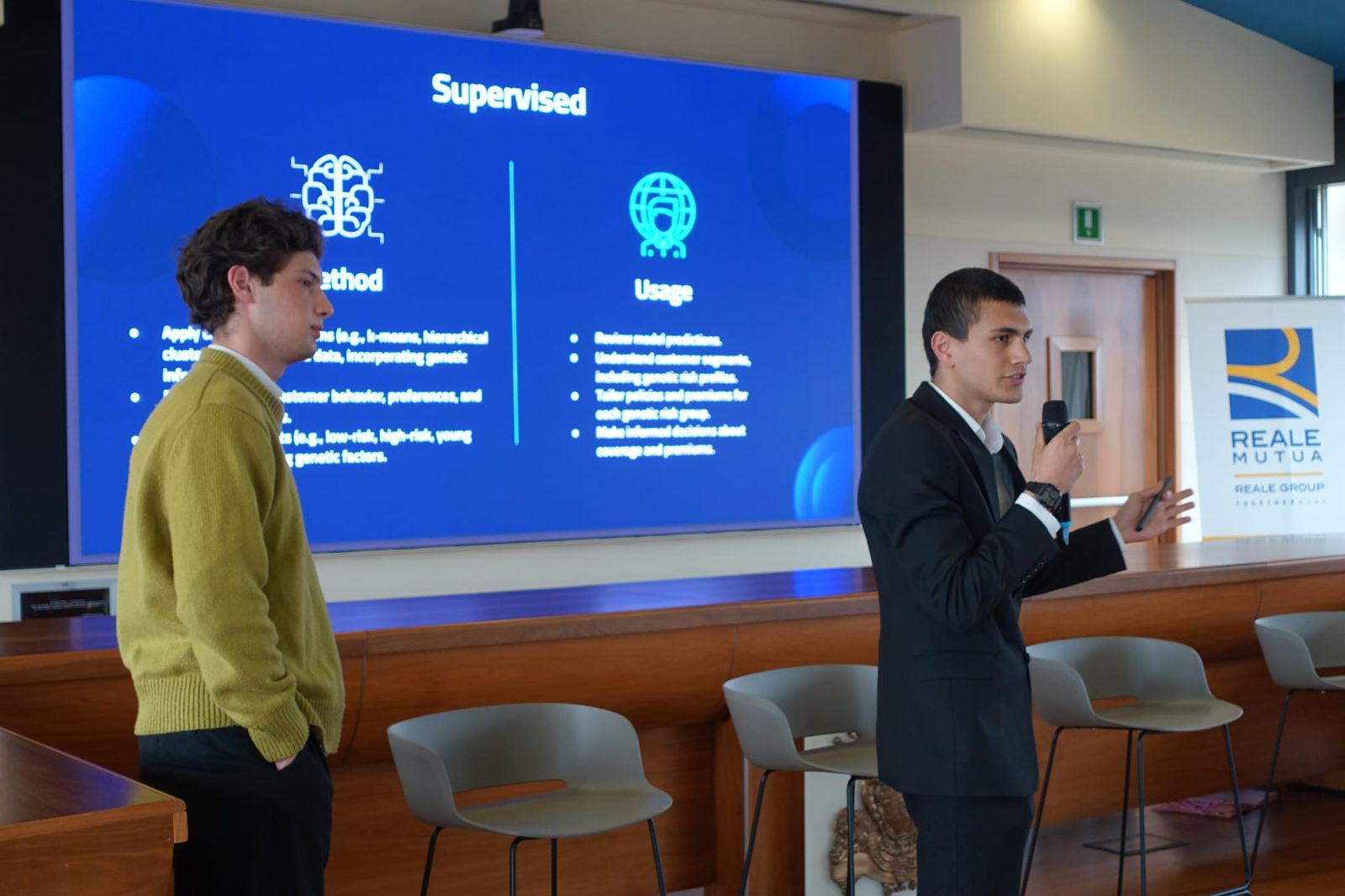 Presenting the project at Reale Mutua, slides on a large screen